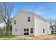Rear view of a modern home featuring a vinyl exterior and patio area at 1148 Thayer Glen Ct, Charlotte, NC 28213