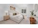 Serene main bedroom with neutral tones, stylish lighting, and a large window for ample natural light at 1148 Thayer Glen Ct, Charlotte, NC 28213