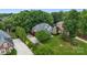 Aerial view of a beautiful home, basketball court, and a huge, green backyard at 1200 Churchill Downs Dr, Waxhaw, NC 28173