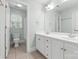 Bright bathroom featuring double sinks, tile flooring, and a shower-tub combo with a natural light window at 1200 Churchill Downs Dr, Waxhaw, NC 28173