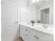 Bright bathroom with a double vanity, neutral color palette, and a large mirror at 1200 Churchill Downs Dr, Waxhaw, NC 28173
