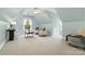 Bonus room featuring an attic ceiling, plush carpet, a ceiling fan, and furniture that invites lounging at 1200 Churchill Downs Dr, Waxhaw, NC 28173