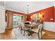 Elegant dining room with stylish chandelier, large windows, and exquisite detailing on the walls at 1200 Churchill Downs Dr, Waxhaw, NC 28173