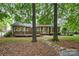 Brick home with a lush front yard and stone walkway to a covered porch at 1200 Churchill Downs Dr, Waxhaw, NC 28173