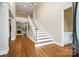 Grand foyer with hardwood floors and staircase showcasing the home's open design at 1200 Churchill Downs Dr, Waxhaw, NC 28173