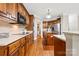 Traditional kitchen with wood cabinets, granite countertops, and stainless steel appliances at 1200 Churchill Downs Dr, Waxhaw, NC 28173