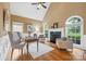 Inviting living room featuring a fireplace, vaulted ceiling, and large windows offering ample natural light at 1200 Churchill Downs Dr, Waxhaw, NC 28173