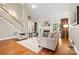 Bright living room featuring a fireplace, vaulted ceiling, and hardwood floors at 1200 Churchill Downs Dr, Waxhaw, NC 28173