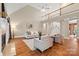 Spacious living room with high ceilings, hardwood floors, and ample natural light at 1200 Churchill Downs Dr, Waxhaw, NC 28173