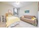 Cozy bedroom featuring a single bed, comfortable sofa, soft lighting and bright window offering pleasant views at 121 Martingale Ave, Mooresville, NC 28115