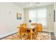 Inviting dining room with hardwood floors, bright natural light, and elegant decor at 121 Martingale Ave, Mooresville, NC 28115