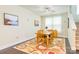Inviting dining room with hardwood floors, bright natural light, and an elegant ceiling fan at 121 Martingale Ave, Mooresville, NC 28115