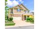 Charming two-story home with stone accents, a spacious driveway, and a two-car garage at 121 Martingale Ave, Mooresville, NC 28115