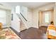 Spacious entry featuring hardwood floors, stairs, and natural light that create a warm, inviting atmosphere at 121 Martingale Ave, Mooresville, NC 28115