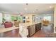 Open concept kitchen with granite countertops, stainless steel appliances, and hardwood floors at 121 Martingale Ave, Mooresville, NC 28115