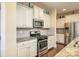 Modern kitchen with stainless steel appliances, granite countertops, and ample cabinet space at 121 Martingale Ave, Mooresville, NC 28115