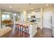 Stylish kitchen with stainless steel appliances, a granite countertop island, and dark hardwood floors at 121 Martingale Ave, Mooresville, NC 28115