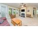 Comfortable living area offering ample natural light, a fireplace, and neutral carpeting at 121 Martingale Ave, Mooresville, NC 28115