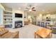 Inviting living room with fireplace, built-in shelving, and open floor plan to the modern kitchen at 121 Martingale Ave, Mooresville, NC 28115