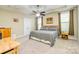 Spacious main bedroom with tray ceiling, neutral carpet, and plenty of natural light at 121 Martingale Ave, Mooresville, NC 28115