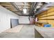 Unfinished basement featuring exposed ductwork, and walls, with a workbench along the back wall at 137 Deal Ln, Statesville, NC 28677