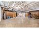 Unfinished basement with concrete flooring, exposed ceiling, wood paneling, and open space at 137 Deal Ln, Statesville, NC 28677