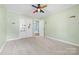 Bedroom with Minion stickers, neutral carpet, a window, a closet and a rainbow fan at 137 Deal Ln, Statesville, NC 28677