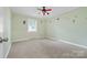 Bedroom decorated with colorful wall stickers, a neutral carpet, and a window, offering a playful space at 137 Deal Ln, Statesville, NC 28677