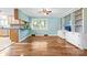 Open dining area with hardwood floors, built-in shelving, and backyard view at 137 Deal Ln, Statesville, NC 28677