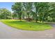 Charming ranch-style brick home with mature trees and landscaping on a large lot at 137 Deal Ln, Statesville, NC 28677