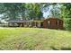 Charming brick ranch with a well-maintained lawn and a cozy, covered carport at 137 Deal Ln, Statesville, NC 28677