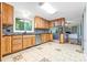 Bright kitchen featuring wood cabinets, stainless steel appliances, and a mosaic backsplash at 137 Deal Ln, Statesville, NC 28677