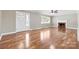 Inviting living room with shiny hardwood floors, fireplace, and ample natural light at 137 Deal Ln, Statesville, NC 28677