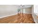 Bright living room with hardwood floors, white trim, and a ceiling fan, creating an inviting space at 137 Deal Ln, Statesville, NC 28677