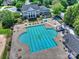 Overhead shot of community pool and recreation area, featuring a large pool and playground at 16430 New Providence Ln, Charlotte, NC 28277