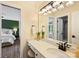 Bright bathroom vanity with modern fixtures and a view into an adjacent bedroom space at 16430 New Providence Ln, Charlotte, NC 28277