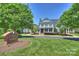 Stately clubhouse with classic architectural details, manicured lawns, and a welcoming entrance at 16430 New Providence Ln, Charlotte, NC 28277
