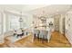 Bright, open kitchen features a large island, stainless steel appliances, and adjacent dining area at 16430 New Providence Ln, Charlotte, NC 28277