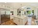 Modern kitchen with a large island and stainless steel refrigerator at 16430 New Providence Ln, Charlotte, NC 28277