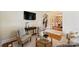 Comfortable living room featuring hardwood floors, an archway, and a view of the staircase and dining room at 16430 New Providence Ln, Charlotte, NC 28277