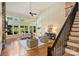 Bright living room with staircase featuring high ceilings and ample natural light at 16430 New Providence Ln, Charlotte, NC 28277