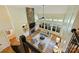 High angle of bright living room with a stone fireplace at 16430 New Providence Ln, Charlotte, NC 28277