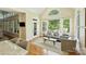 Bright living room with large windows and vaulted ceilings, filled with natural light at 16430 New Providence Ln, Charlotte, NC 28277