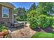 Charming outdoor kitchen with a built-in grill and bar seating, perfect for entertaining by the pool at 16430 New Providence Ln, Charlotte, NC 28277