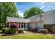 Back exterior view showcasing the home's backyard, patio area, landscaping, and mature trees at 1666 Sam Smith Rd, Fort Mill, SC 29708