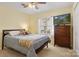 Serene bedroom with neutral carpet, warm yellow walls, and a TV at 1666 Sam Smith Rd, Fort Mill, SC 29708