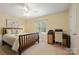 Cozy bedroom featuring a ceiling fan, ample natural light, and a comfortable study area at 1666 Sam Smith Rd, Fort Mill, SC 29708