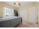 Cozy bedroom featuring a bed, TV, window with blinds and carpet floors at 1666 Sam Smith Rd, Fort Mill, SC 29708