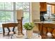 Cozy dining area with wood table, candles, and a plant arrangement by the window at 1666 Sam Smith Rd, Fort Mill, SC 29708