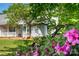 Charming home exterior featuring a welcoming porch, bright-colored front door, and beautifully landscaped front yard at 1666 Sam Smith Rd, Fort Mill, SC 29708
